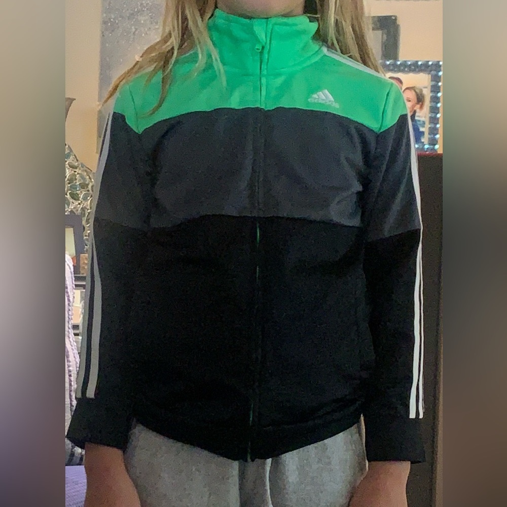 Adidas zipped jacket. Kids size 7. Black and neon green.